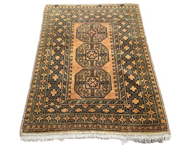 Lot 1433 - Afghan Nahzat rug with three central medallions on gold and green ground, 142cm x 98cm