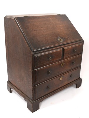 Lot 853 - George III miniature oak bureau