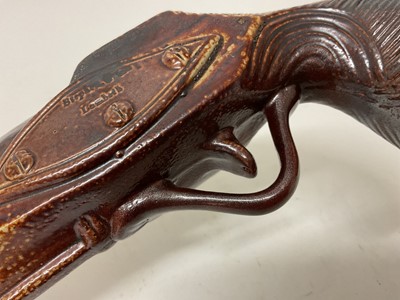 Lot 151 - Two 19th century salt glaze spirit flasks in the form of pistols