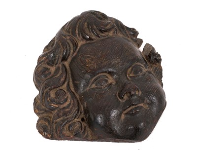 Lot 857 - 17th century carved oak cherub mask