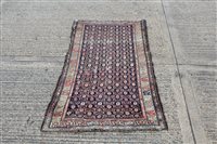 Lot 1550 - Persian rug, the navy field with allover...