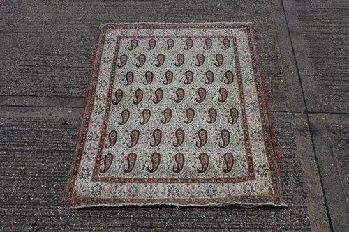 Lot 1552 - Persian silk rug, the cream ground with...
