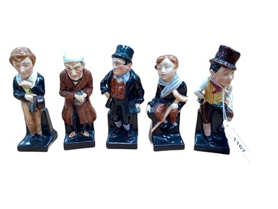 Lot 1167 - Group of 11 Royal Doulton Dickens figures and a silver ashtray