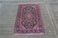 Lot 1554 - Kashan rug, the navy foliate field within...