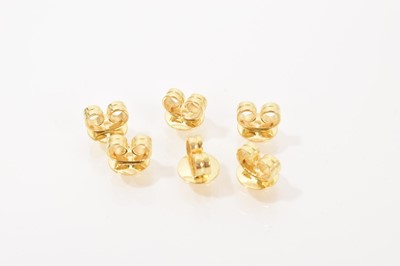 Lot 504 - Three pairs of gold butterfly earring clips