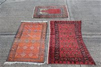 Lot 1556 - Eastern rug, brick-red ground with lattice of...
