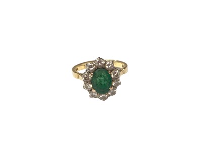 Lot 100 - Emerald and diamond cluster ring in 18ct gold setting