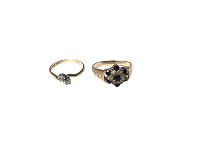 Lot 102 - Antique diamond two stone ring in cross over setting and a 9ct gold sapphire and synthetic white stone cluster ring (2)