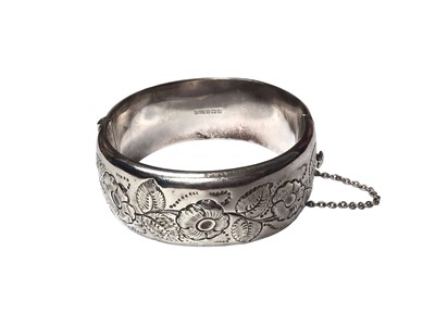 Lot 103 - 1960s silver cuff bangle with embossed floral decoration (Birmingham 1964)