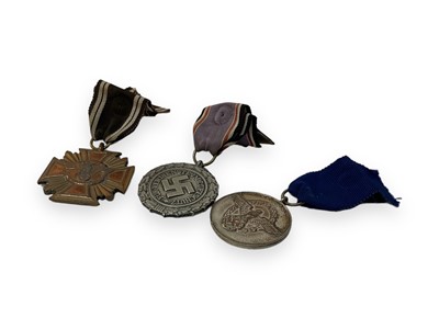 Lot 717 - Second World War Luftschutz civil defence medal, together with a Nazi Police long service medal and a NSDAP 10 year service medal (3).