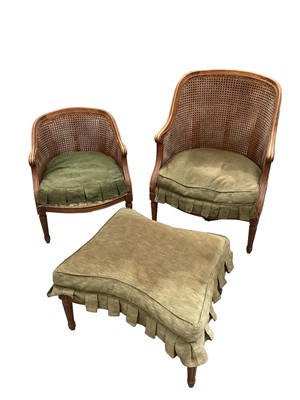 Lot 1374 - Suite of early 20th century French carved beech bergere furniture comprising an armchair, low chair and shaped stool (3)