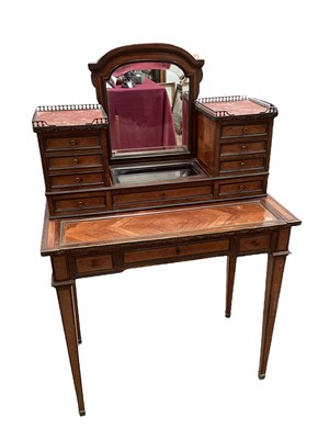 Lot 1378 - Late 19th century French kingwood veneered dressing table with arched bevelled mirror and an arrangement of nine drawers above a table with three further drawers on square taper legs