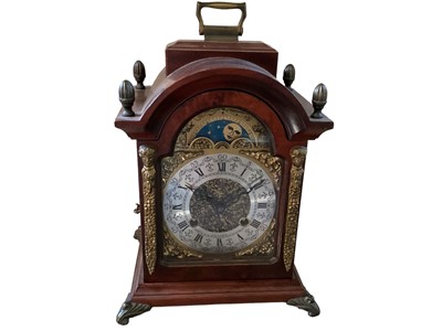 Lot 723 - Franzhermle Dutch wooden cased mantle clock with brass finials, Roman & Figure dial, revolving sun & moon dial and chime (1)