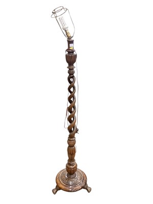 Lot 1268 - A Barley twist standard lamp with turned tripod base (1)