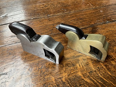 Lot 2419 - Two small bull nose planes, the largest in steel and ebony, by Norris, 13cm long, another similar in gunmetal, apparently unsigned. (2)