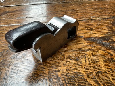 Lot 2419 - Two small bull nose planes, the largest in steel and ebony, by Norris, 13cm long, another similar in gunmetal, apparently unsigned. (2)