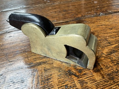 Lot 2419 - Two small bull nose planes, the largest in steel and ebony, by Norris, 13cm long, another similar in gunmetal, apparently unsigned. (2)