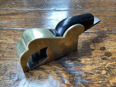 Lot 2419 - Two small bull nose planes, the largest in steel and ebony, by Norris, 13cm long, another similar in gunmetal, apparently unsigned. (2)