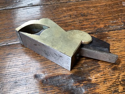 Lot 2419 - Two small bull nose planes, the largest in steel and ebony, by Norris, 13cm long, another similar in gunmetal, apparently unsigned. (2)