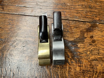 Lot 2419 - Two small bull nose planes, the largest in steel and ebony, by Norris, 13cm long, another similar in gunmetal, apparently unsigned. (2)