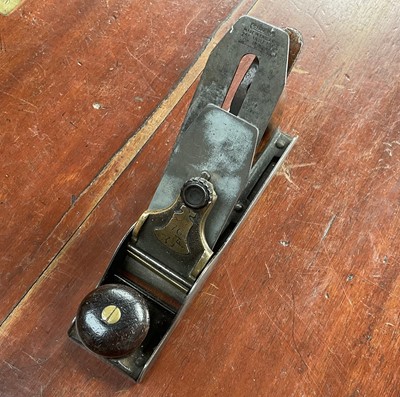 Lot 2446 - Antique Stanley Liberty Bell no. 104-105 steel smoother plane and an antique Stanley No.45 adjustable plane with accessories in wooden box (2)