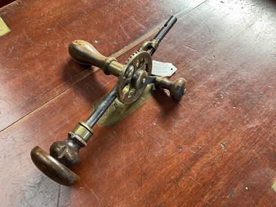 Lot 2402 - Victorian brass mounted bevel gear crank drill brace by John Cartwright, 30.5cm in length.