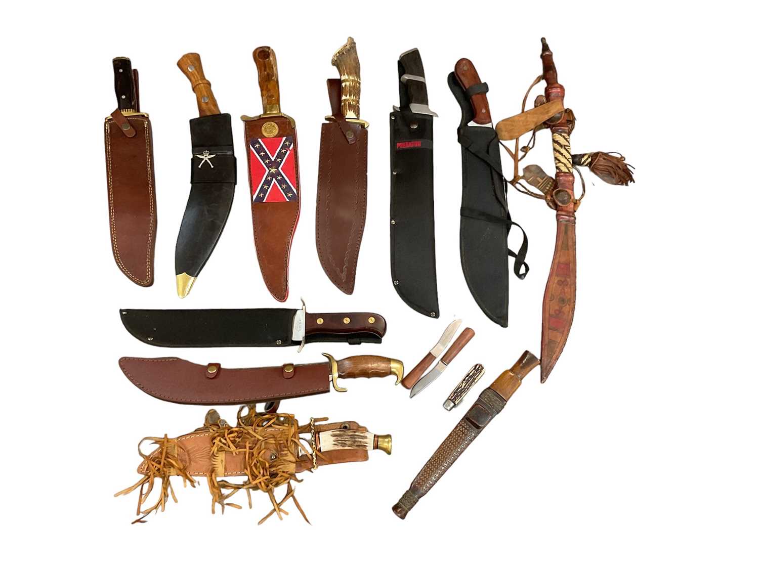 Lot 935 - Collection of knives and daggers to include Kukri, African tribal knives and others (1 box).