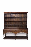 Lot 1612 - 18th century and later oak high dresser with...