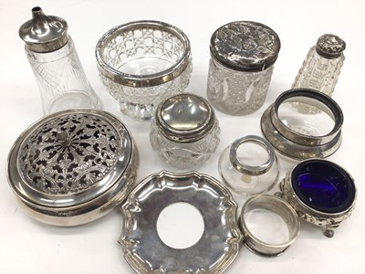 Lot 31 - Group of silver mounted glass jars, castors etc, Victorian silver salt with blue glass liner, silver napkin ring, continental silver (800) pot pourri bowl and cover and a continental silver mount...