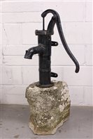 Lot 1616 - Antique cast iron pump mounted on natural...