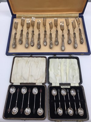 Lot 33 - Two cased sets of six silver bean end coffee spoons and a set of twelve Italian silver (800) handled forks in fitted case