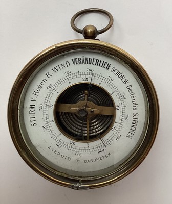 Lot 2599 - Antique German brass cased aneroid barometer, 10cm diameter