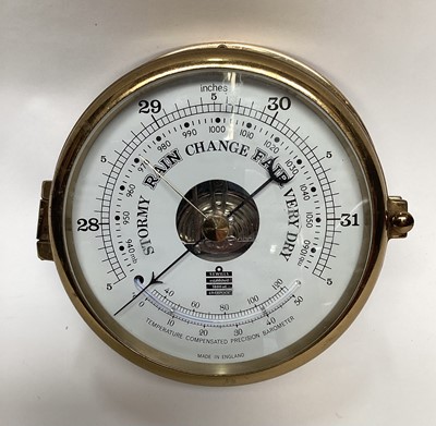 Lot 2597 - Sewills brass cased ships' barometer, 18cm diameter