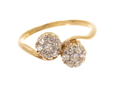 Lot 451 - Antique diamond double daisy cluster ring with twelve old cut diamonds estimated to weigh approximately 0.34cts in total, in claw setting with crossover shoulders on 18ct yellow gold shank.