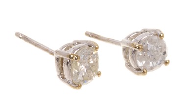 Lot 456 - Pair of diamond single stone stud earrings in four claw 18ct white gold setting