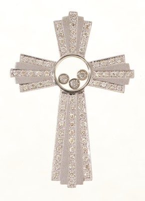 Lot 461 - Diamond cross pendant with floating diamonds in a central glazed compartment with further brilliant cu diamonds in 9ct white gold setting