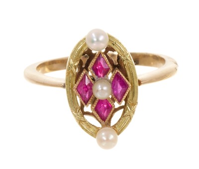 Lot 473 - Edwardian seed pearl and synthetic ruby oval plaque ring in a two-colour gold setting