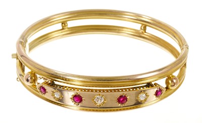 Lot 504 - Victorian ruby and diamond hinged bangle