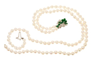 Lot 507 - Cultured pearl two-strand necklace with a jade and diamond cluster clasp