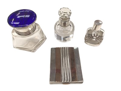 Lot 117 - Art Deco French silver and rose gold powder compact by Keller, Paris, together with a silver mounted and blue enamel smelling salts bottle snd two silver mounted glass scent bottles