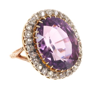 Lot 442 - Late Victorian amethyst and diamond cluster ring with a large oval mixed cut amethyst surrounded by a border of old cut diamonds