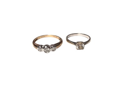 Lot 39 - 9ct gold diamond three stone ring, weighing 0.25cts in total, in a white gold rub over setting, size O½ and a 9ct gold cubic zirconia single stone ring, size J (2)