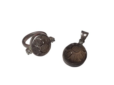 Lot 40 - Carved floral smoky quartz and diamond cocktail ring and matching pendant in white metal settings (2)