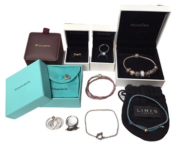 Lot 41 - Pandora 'Moments' silver charm bracelet with various charms, Pandora leather bracelet, three Pandora silver rings, Links of London silver jewellery in pouch, Tiffany & Co single silver teard...