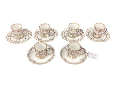 Lot 1122 - Set of six Aynsley coffee cans in pierced silver cup mounts together with six saucers