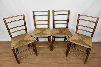 Lot 1256 - Four 19th century elm country chairs with rush seats