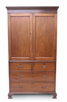 Lot 1643 - George III mahogany linen press of diminutive...