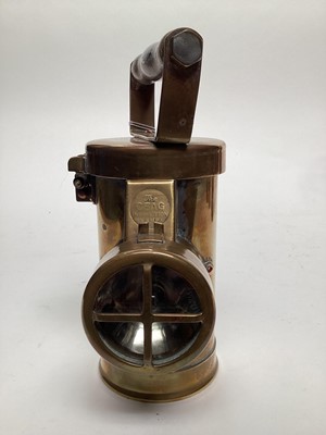 Lot 2626 - The CEAG inspection lamp, a French battery powered copper miners' lamp, a musical miners' lamp and a small Lamp & Limelight lamp (4)