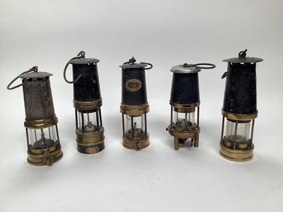 Lot 2627 - Group of black and brass miners' lamps, including one GPO, one Abbot, Birks & Co, and three others (5)