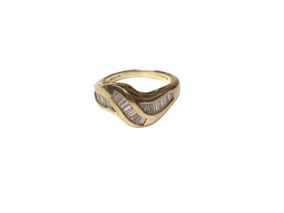 Lot 124 - 18ct gold and diamond ring with baguette cut diamonds in a cross-over design